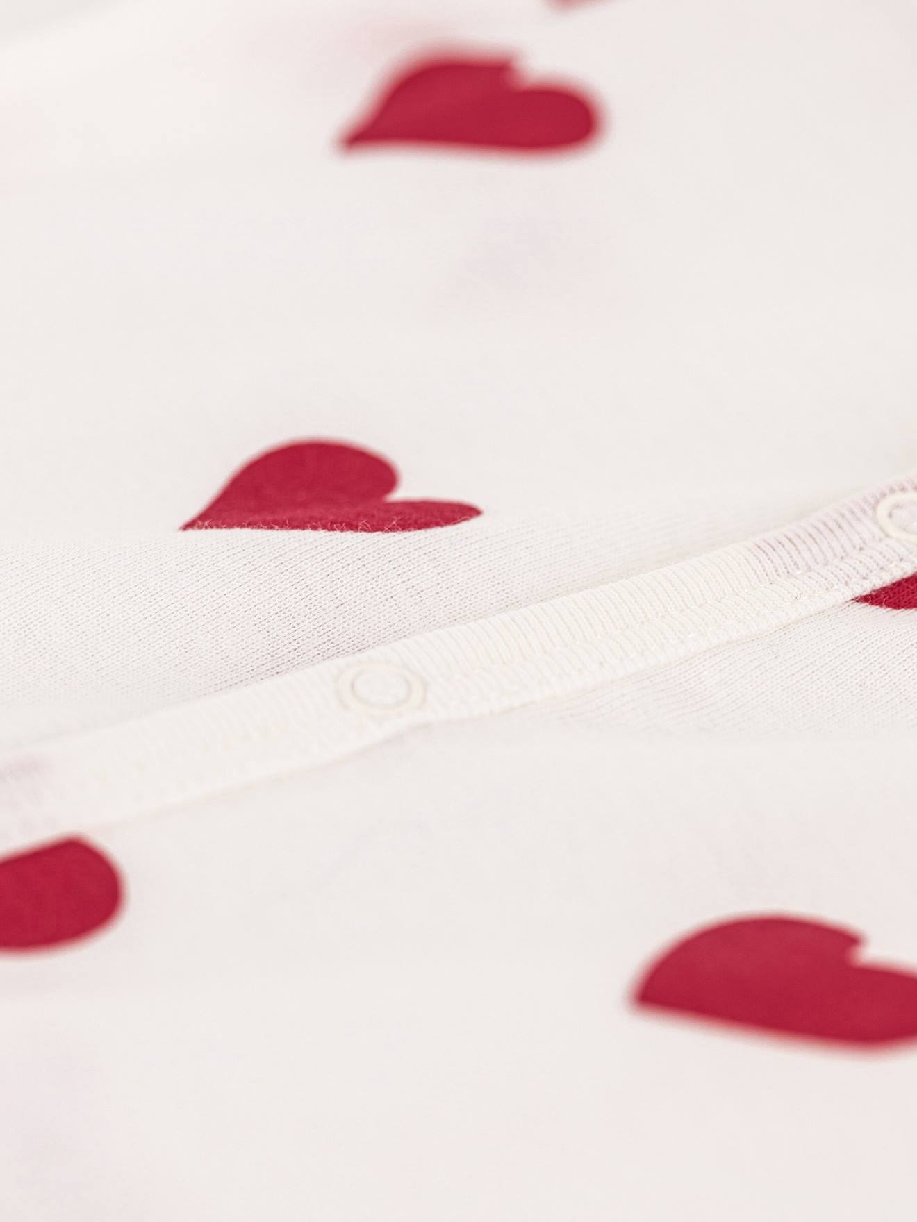 Thumbnail - Baby Kurzarm-Overall aus Baumwolle mit Herzmuster PETIT BATEAU